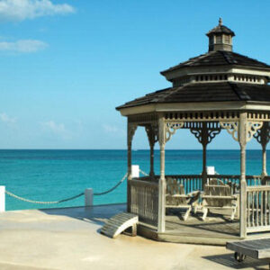 White gazebo with benches on the lawn among the trees - realized object Wood Luxury