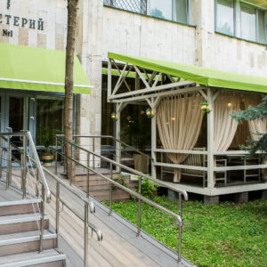 Outdoor cafe terrace with furniture and canopy - completed project Wood Luxury
