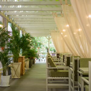 Summer area with white curtains and table settings - completed project Wood Luxury