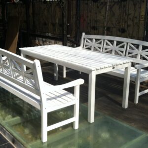 White table and benches with Union Jack decor on a glass floor - Wood Luxury furniture set.