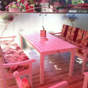 White cafe furniture with rose pillows - textile design by Wood Luxury.