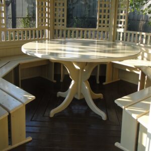 Round cream table and built-in benches in the gazebo - furniture set Wood Luxury.